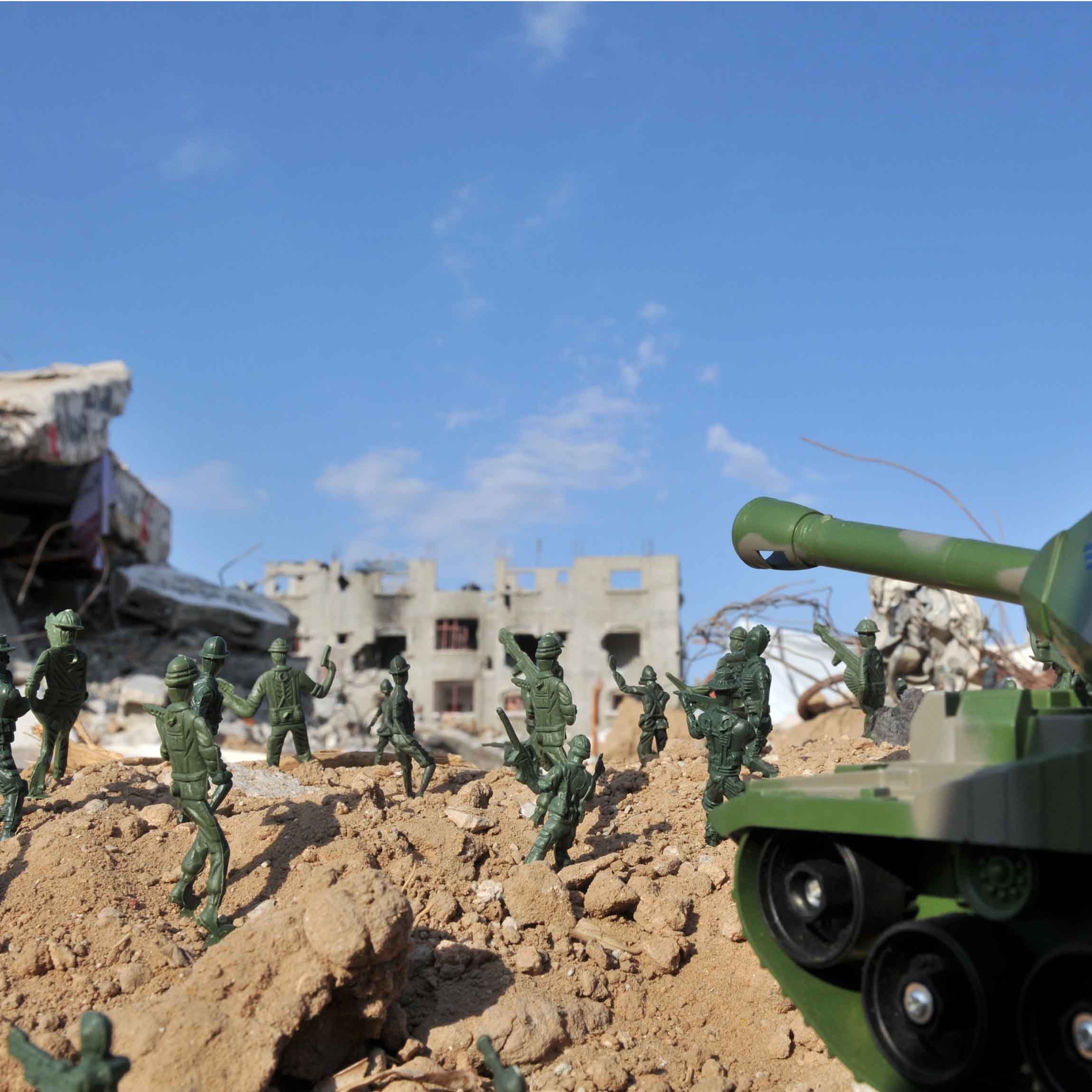 Toy soldiers positioned to depict invading Israeli soldiers and placed in the rubble of destroyed buildings in Gaza.